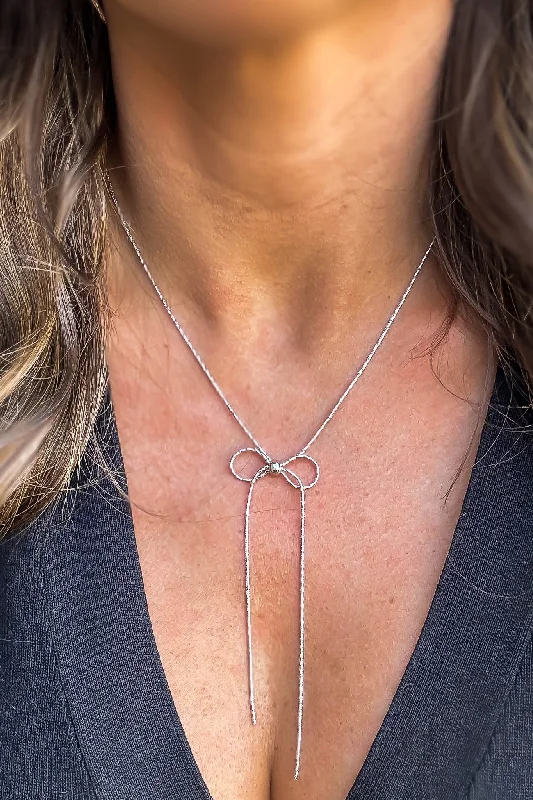 Layered necklaces and pendants for a trendy and fashionable stacked look-It's A Bow Silver Necklace